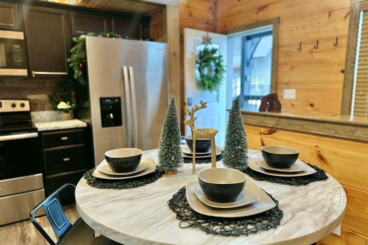 Start your morning gathered around this intimate dining nook, where warm wood tones and winter décor set the scene for slow breakfasts and long conversations.