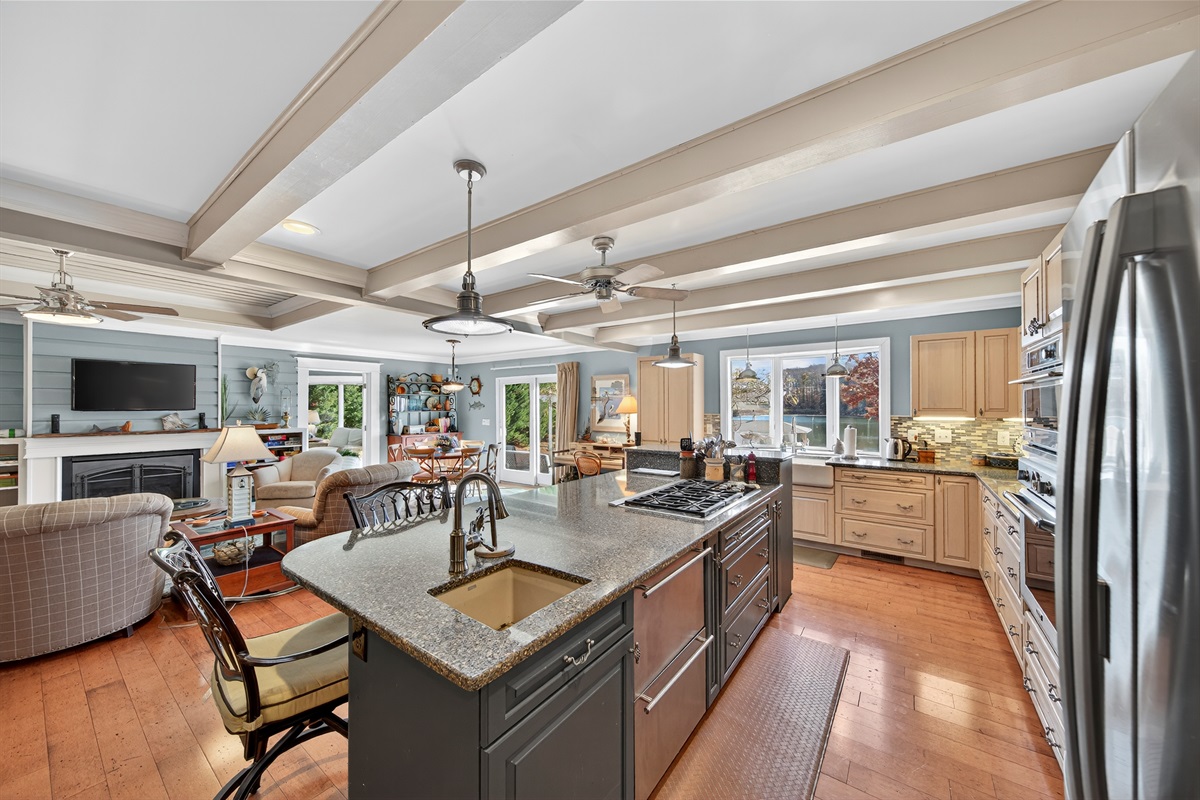 Open-concept layout connects the kitchen to the living and dining areas for easy entertaining.