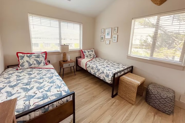 Our twin bed room is our most versatile with 2 pillow top twin beds plus a double sofa bed to accommodate an extra kiddo or two!  A dresser and TV make this space functional. We invite you to settle in watch a movie and get ready for a slumber party! 