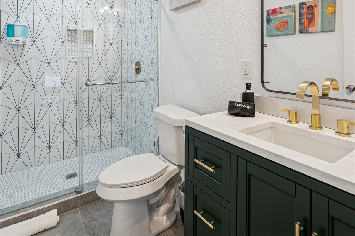 Stylish, fully remodeled bathroom with rainfall-style shower