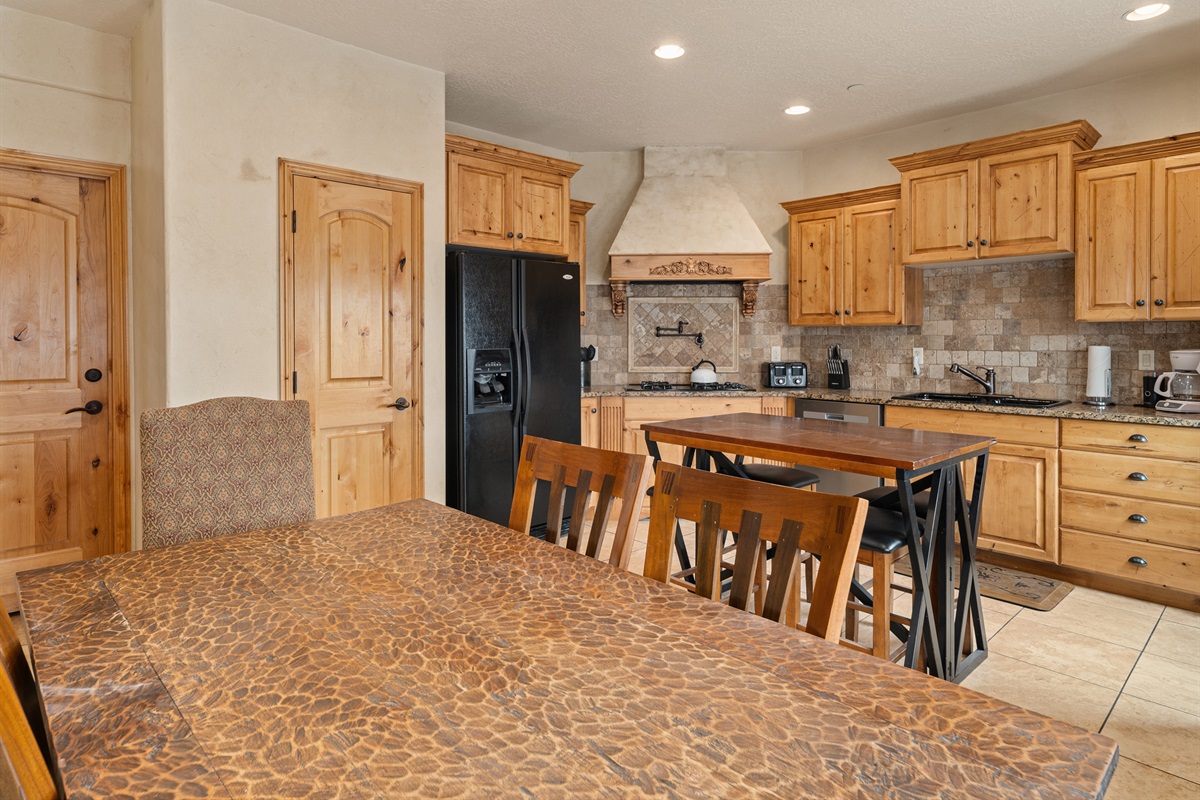 Fully equipped kitchen with warm wood cabinetry