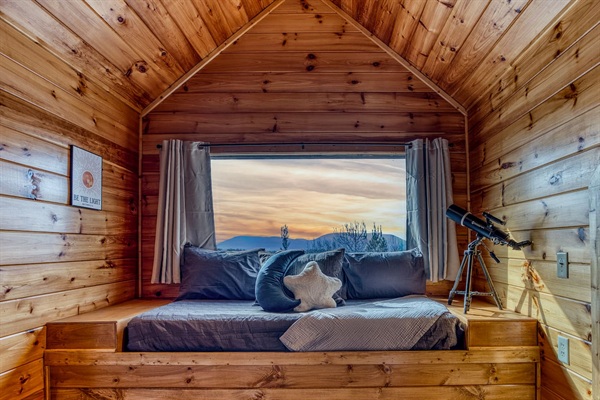 Huge window & amazing mountain views from one of the 2 upstairs bedrooms, both with a sleeping nook with a twin bed (and both also have a king bed and private bathrooms).