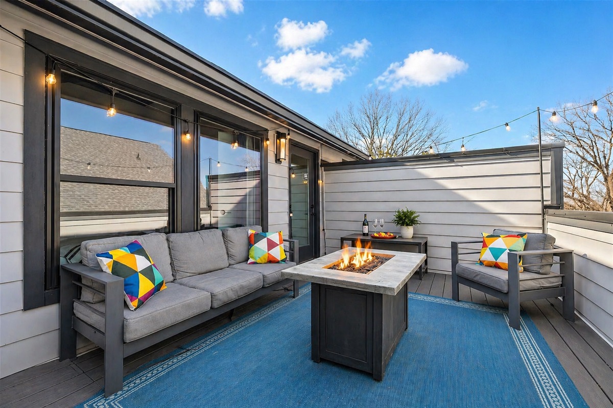 Rooftop deck features a gas fireplace for winding down or enjoying a hot cup of coffee al fresco! The rooftop is perfectly private and sits on the top, or 4th floor, of the townhouse. 