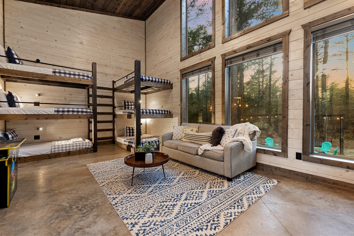 The bunkhouse is a favorite hangout spot with games, cozy seating, and plenty of space for your group to unwind after a day of adventure.