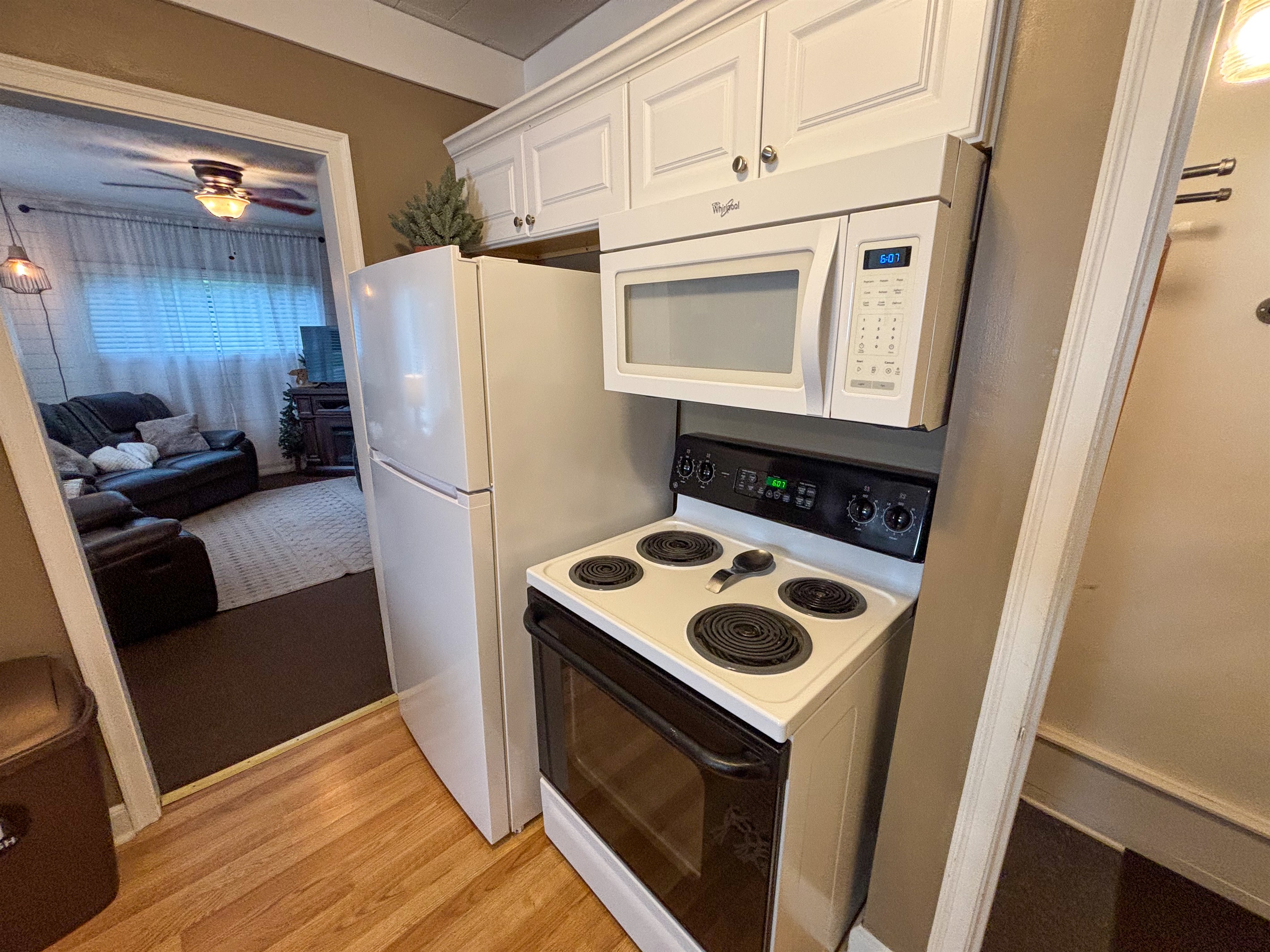 Modern and efficient—everything you need to create a delicious meal. The kitchen features a stainless steel refrigerator, stove, coffee maker, kitchenette oven, kettle, and blender