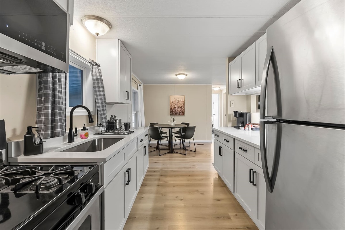 Spacious galley-style kitchen with plenty of counter space and direct access to the dining area.