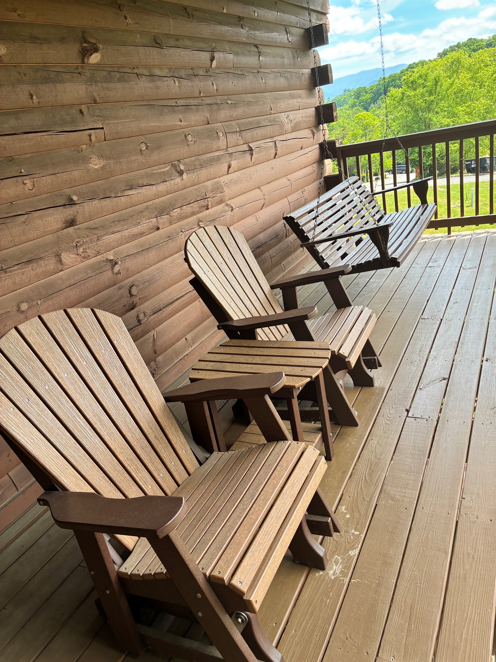 Main level on the outside decks. There is a 4 person table, plus these sturdy rockers, or enjoy the large swing with a view!