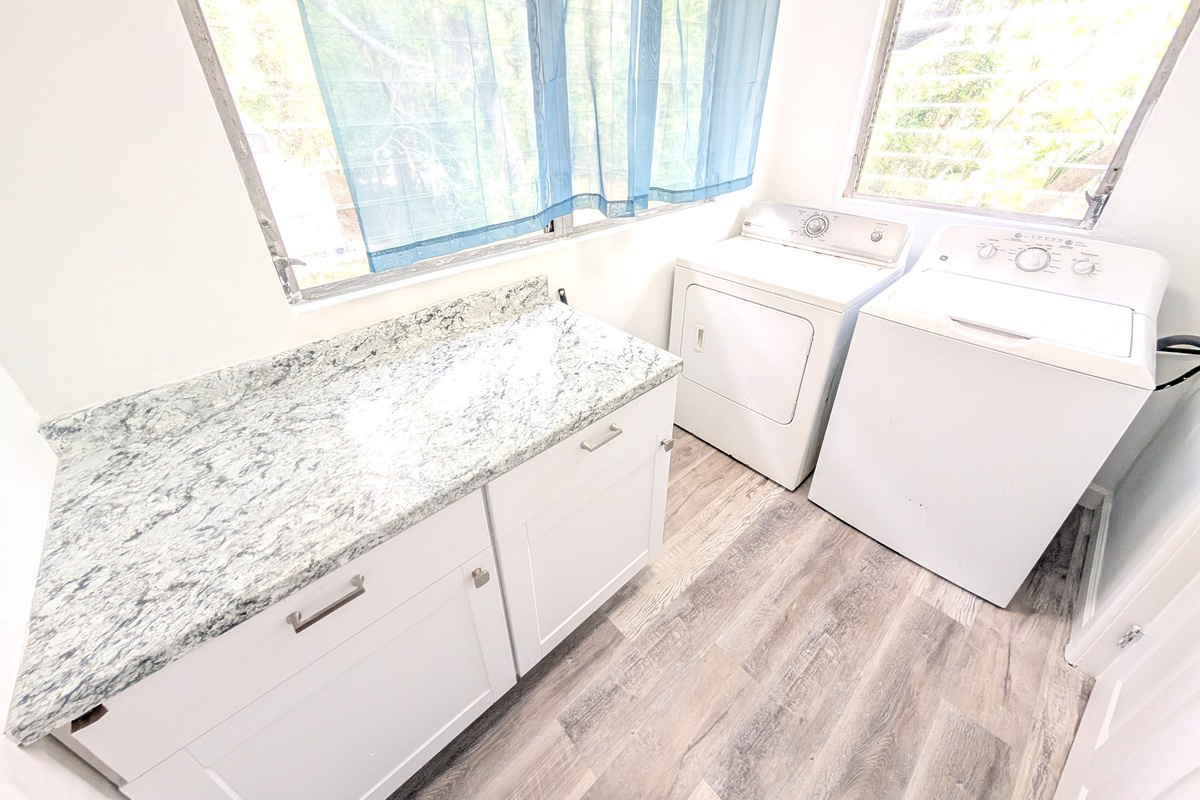 Laundry room with washer / dryer / and folding space