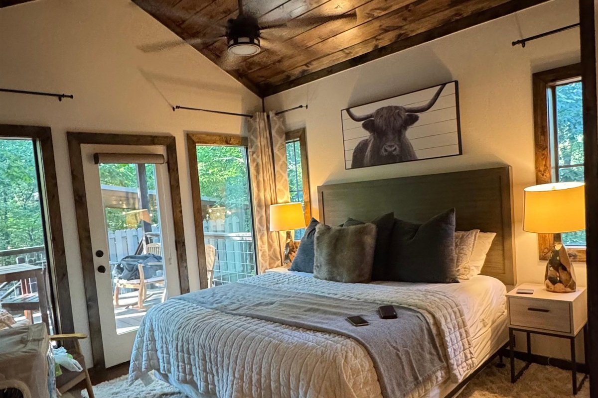 Master bedroom - overlooking the Ouachita National Forest with private access to the large patio from the master bedroom.