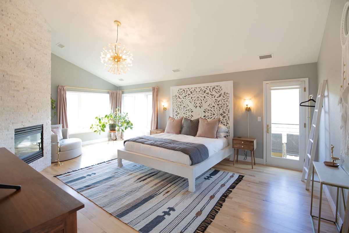 The luxurious master suite is designed for comfort and relaxation, featuring a plush king bed, cozy gas fireplace, and TV for unwinding at the end of the day. 