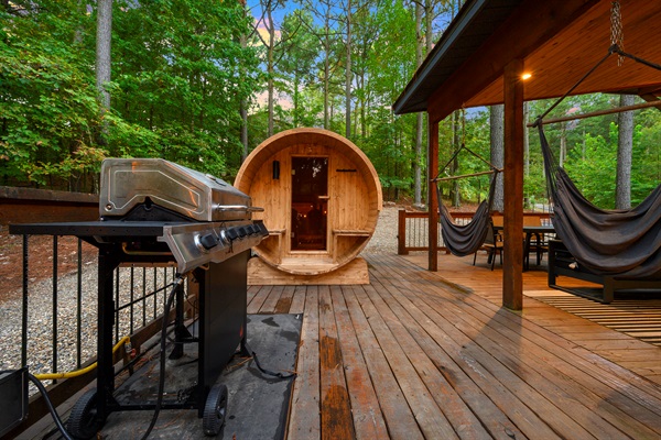 Fire up the grill, unwind in the cedar sauna, or sway in the hammocks beneath the trees — this deck was made for slow mornings, deep breaths, and pure relaxation.
