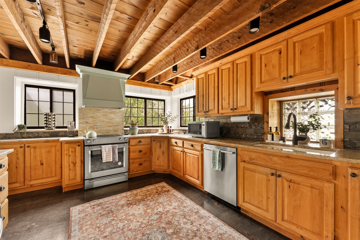A warm, fully equipped kitchen ready for gathering and cooking.