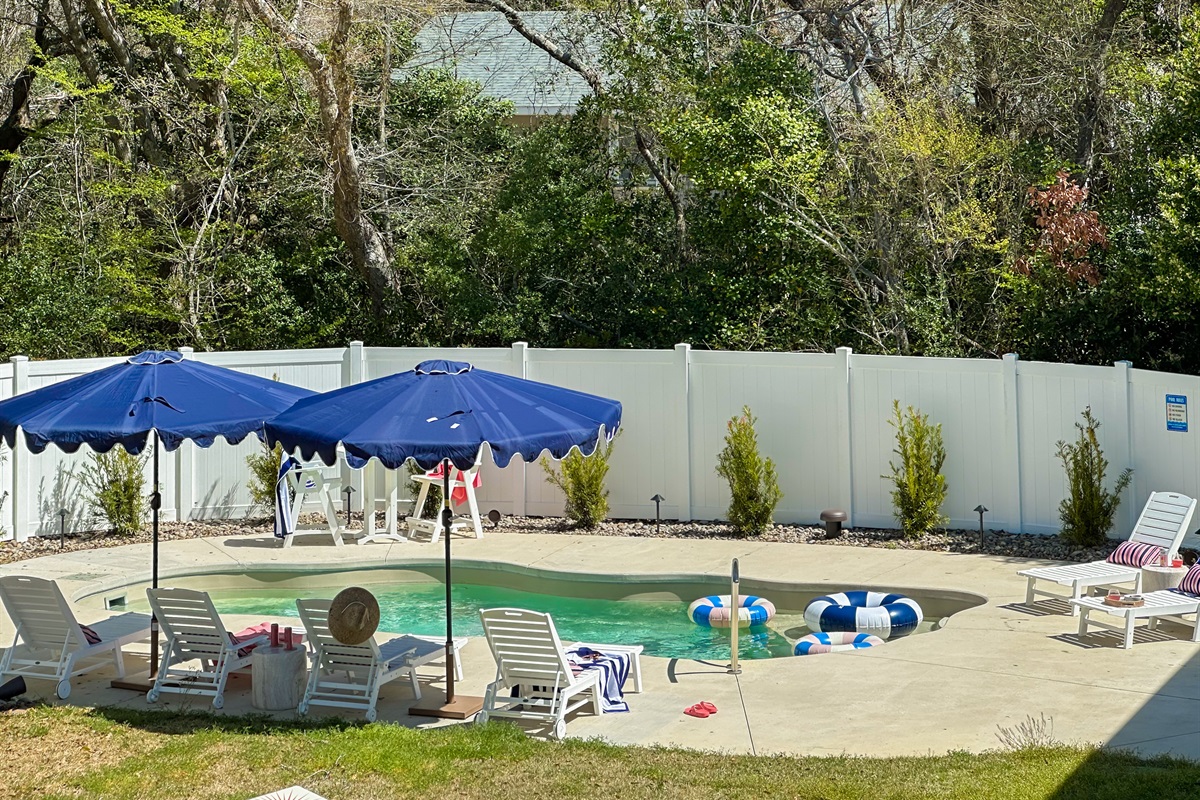 The backyard oasis continues to the private pool.