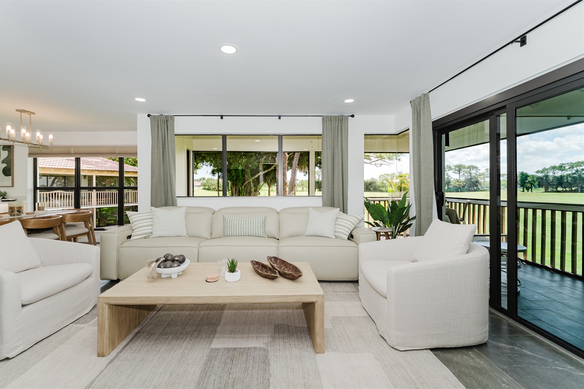 Bright, open living space filled with natural light and golf course views. Comfortable seating perfect for relaxing after a day at the beach or golf. Spacious living area designed for both comfort and style
Seamless indoor-outdoor feel with large windows.