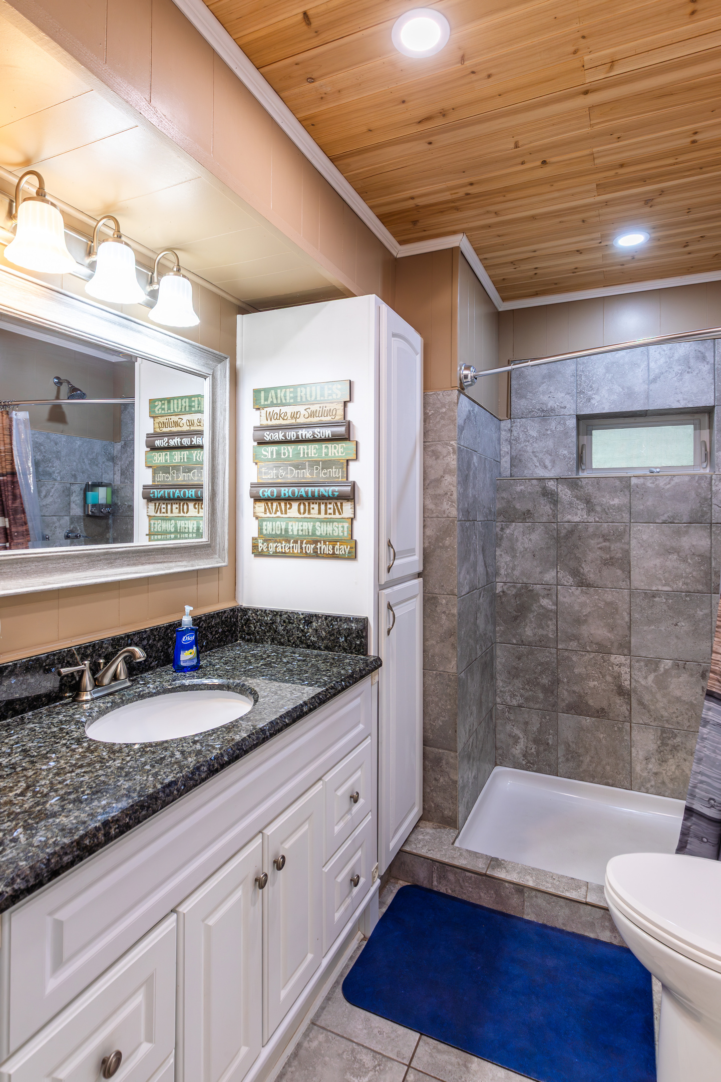 The full bathroom includes a walk-in shower, vanity storage, and the everyday essentials your family needs for an easy stay.