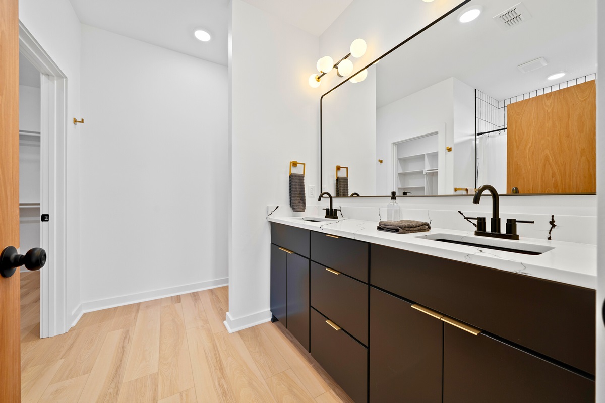 The vanity offers ample counter space, making mornings and evenings feel unhurried.