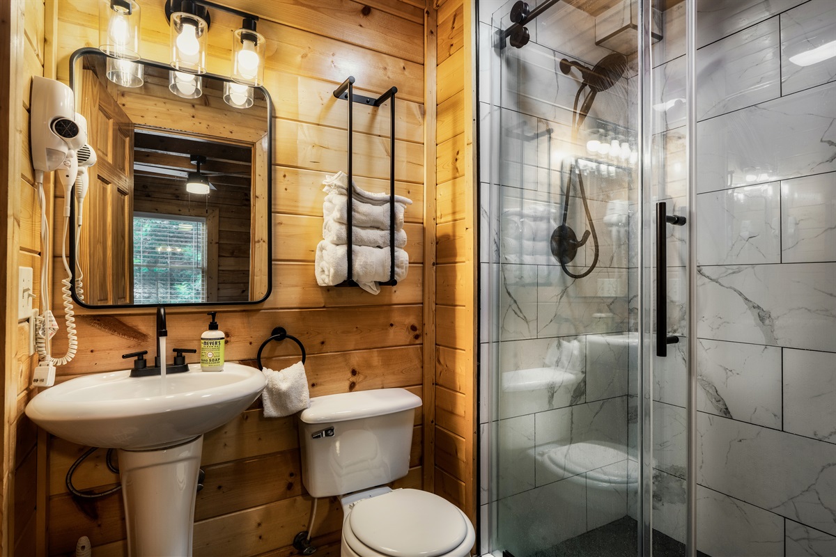Main floor bath features a new step-in shower.