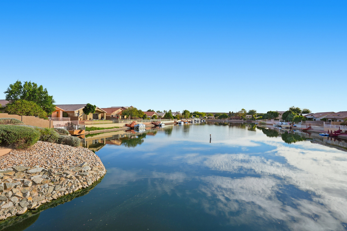 Arrowhead Lakes views with calm water, mountain backdrop, and scenic neighborhood surroundings nearby.