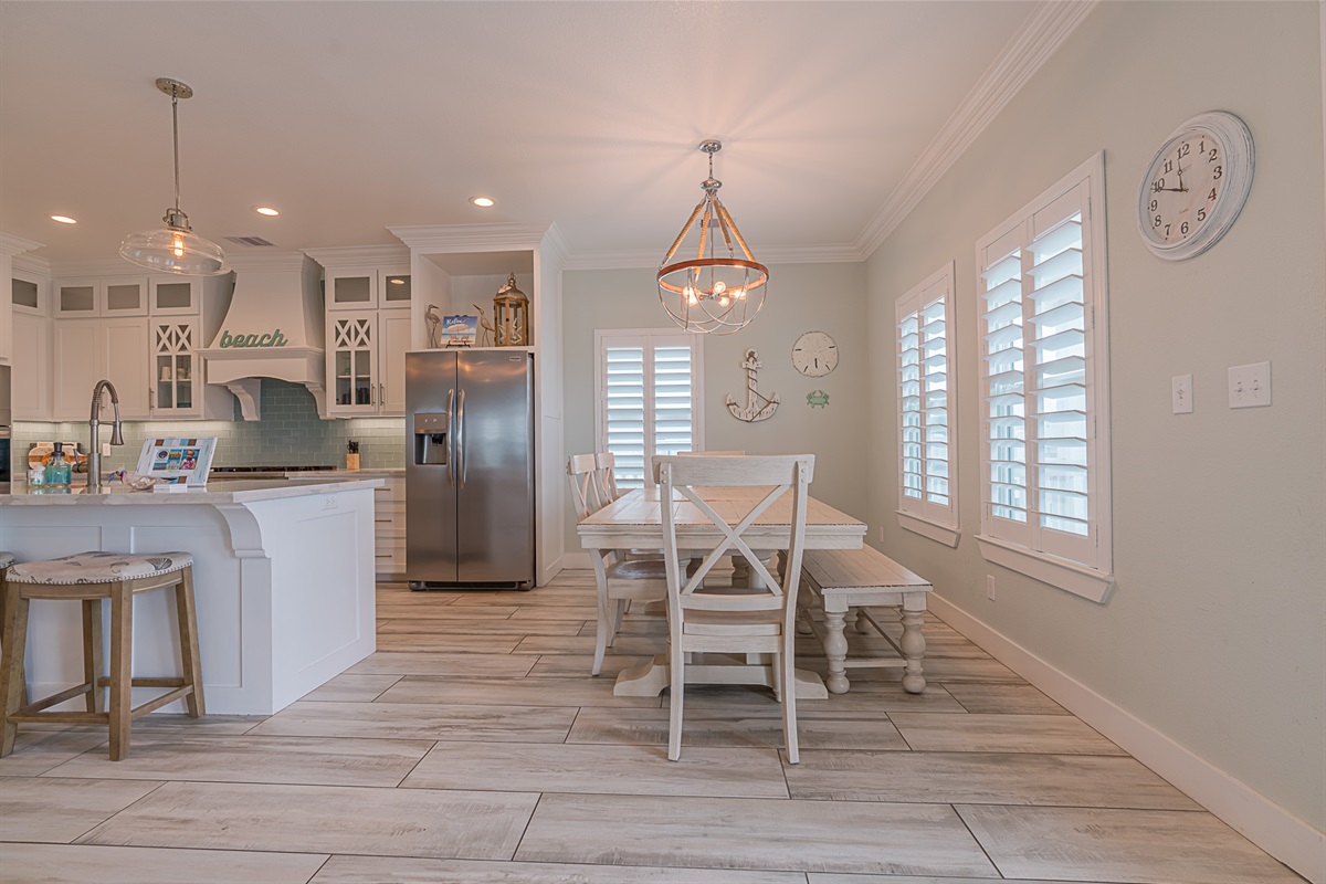 Dining and kitchen area to seat your large group. Dining table seats 6 and island seats 3