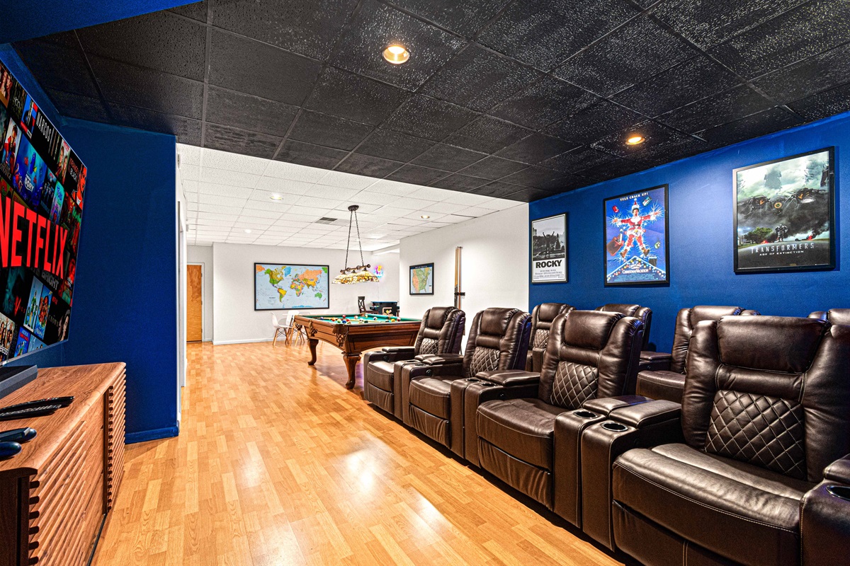 Enjoy movie nights in plush recliners with a giant screen and game room fun!