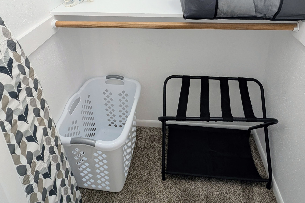 For your convenience, the closet is equipped with a full-sized iron and ironing board, along with extra pillows, blankets, hangers, a luggage rack, and a laundry hamper.