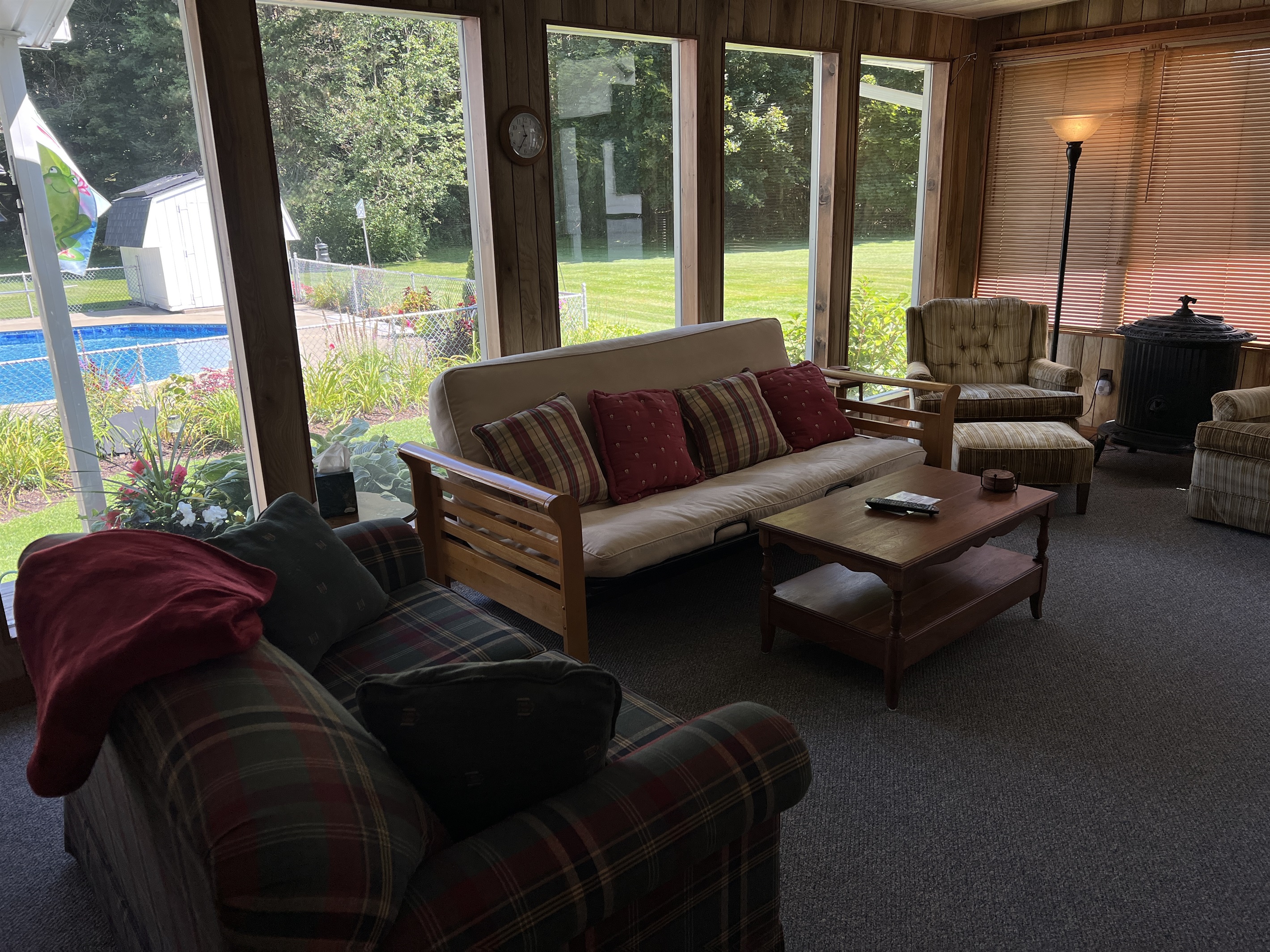 Sunroom overlooking pool and gardens