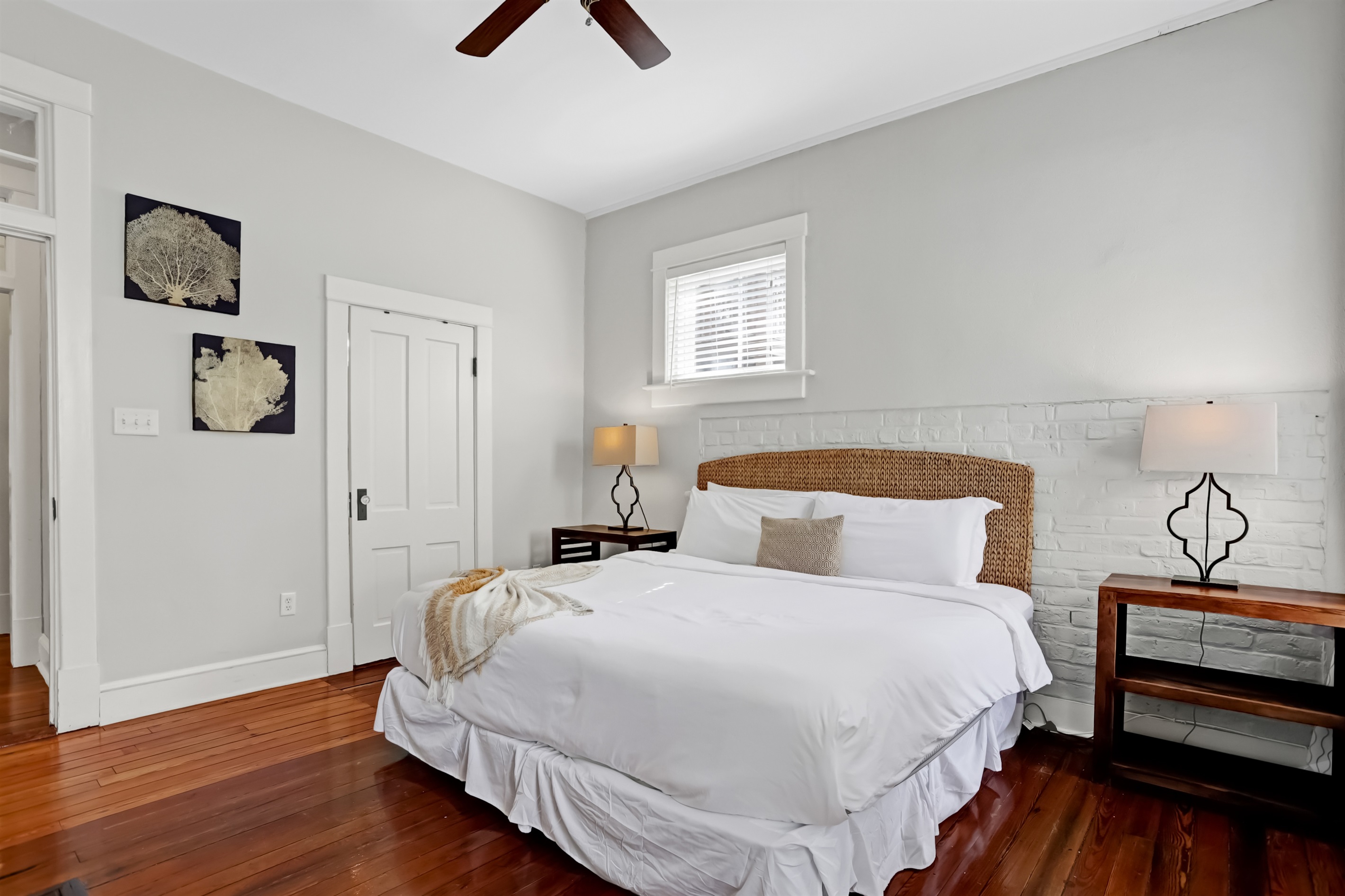 Rest easy in the spacious primary bedroom, featuring a plush king bed and soft natural light.