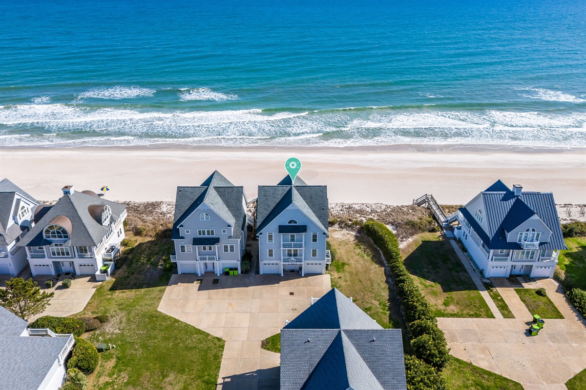 Perfectly situated between the crashing waves and the serene sound.