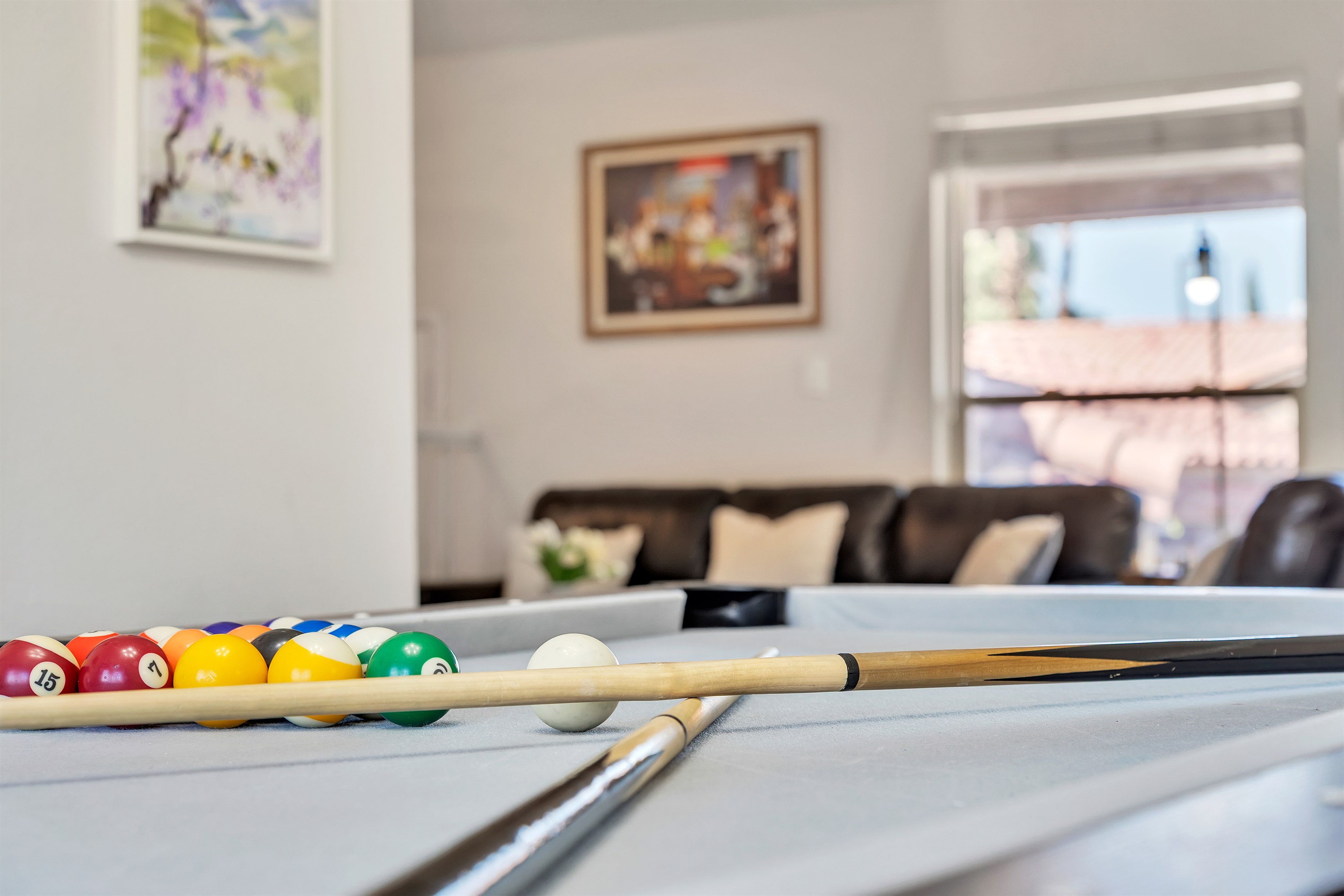 Dining room with large dining table that converts to pool table and ping pong table
