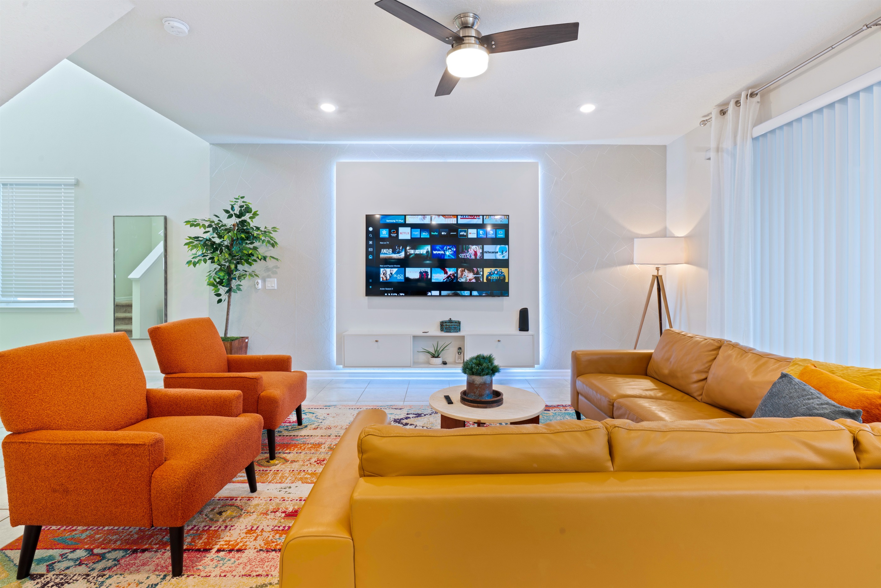 Open-concept layout connects seamlessly to the kitchen and dining area, ideal for gathering with friends or family.