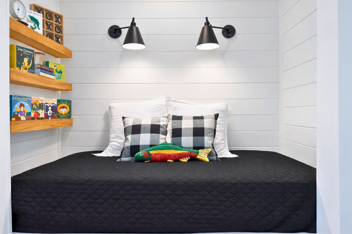 Reading nook with daybed and built-in shelves.