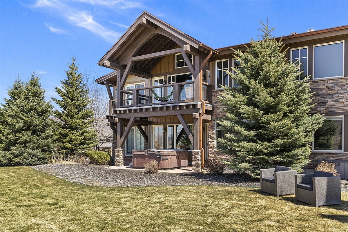 Striking mountain architecture blends natural stone and rich wood accents, creating a distinguished exterior that reflects the beauty of its alpine surroundings.