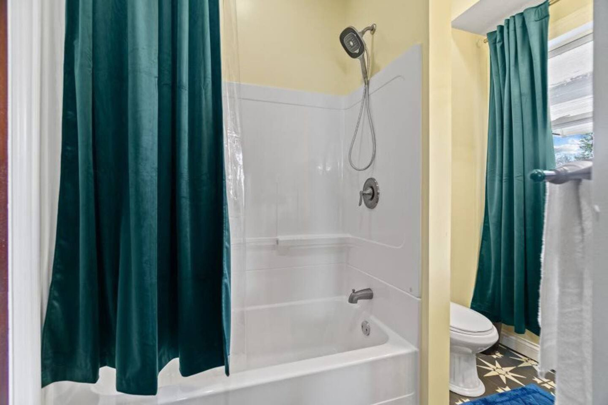 Modern bathroom featuring a relaxing tub, perfect for unwinding after a long day.