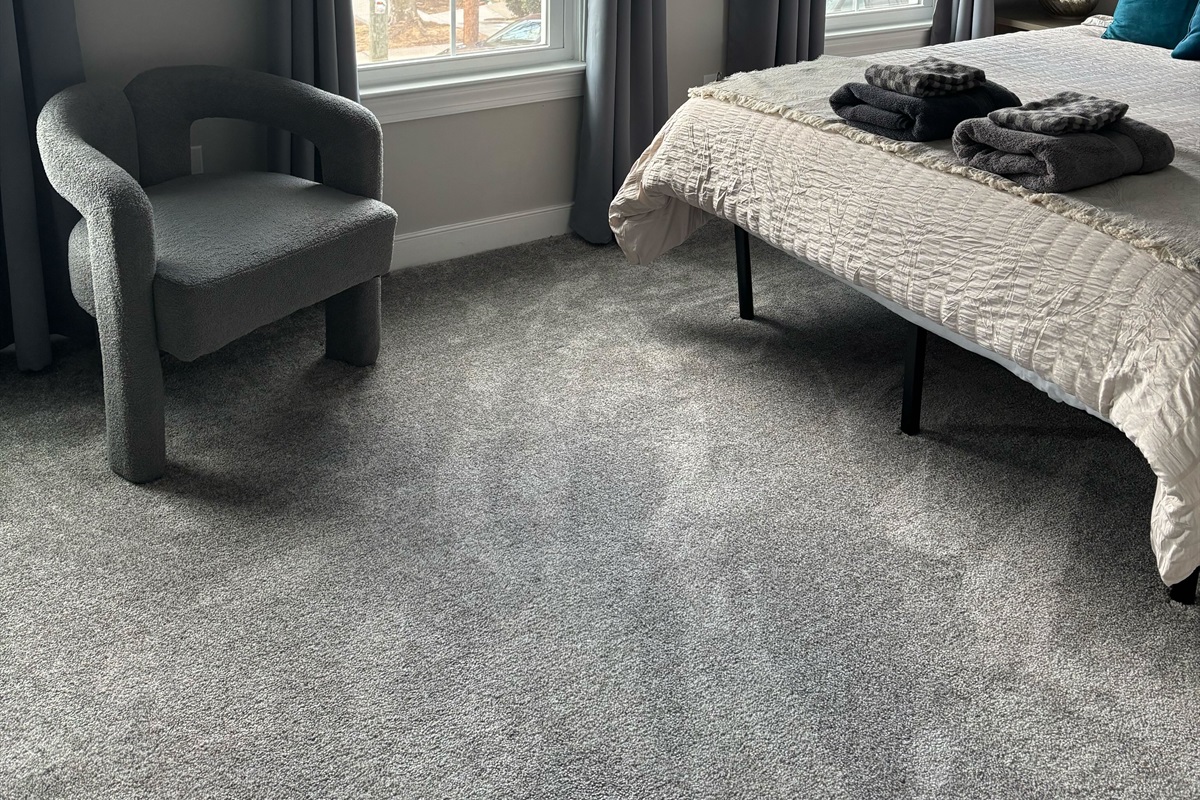 Queen Bedroom 2: Bright room with plush bedding, stylish decor, and sunny views for relaxation. Added Room Darkening Shades