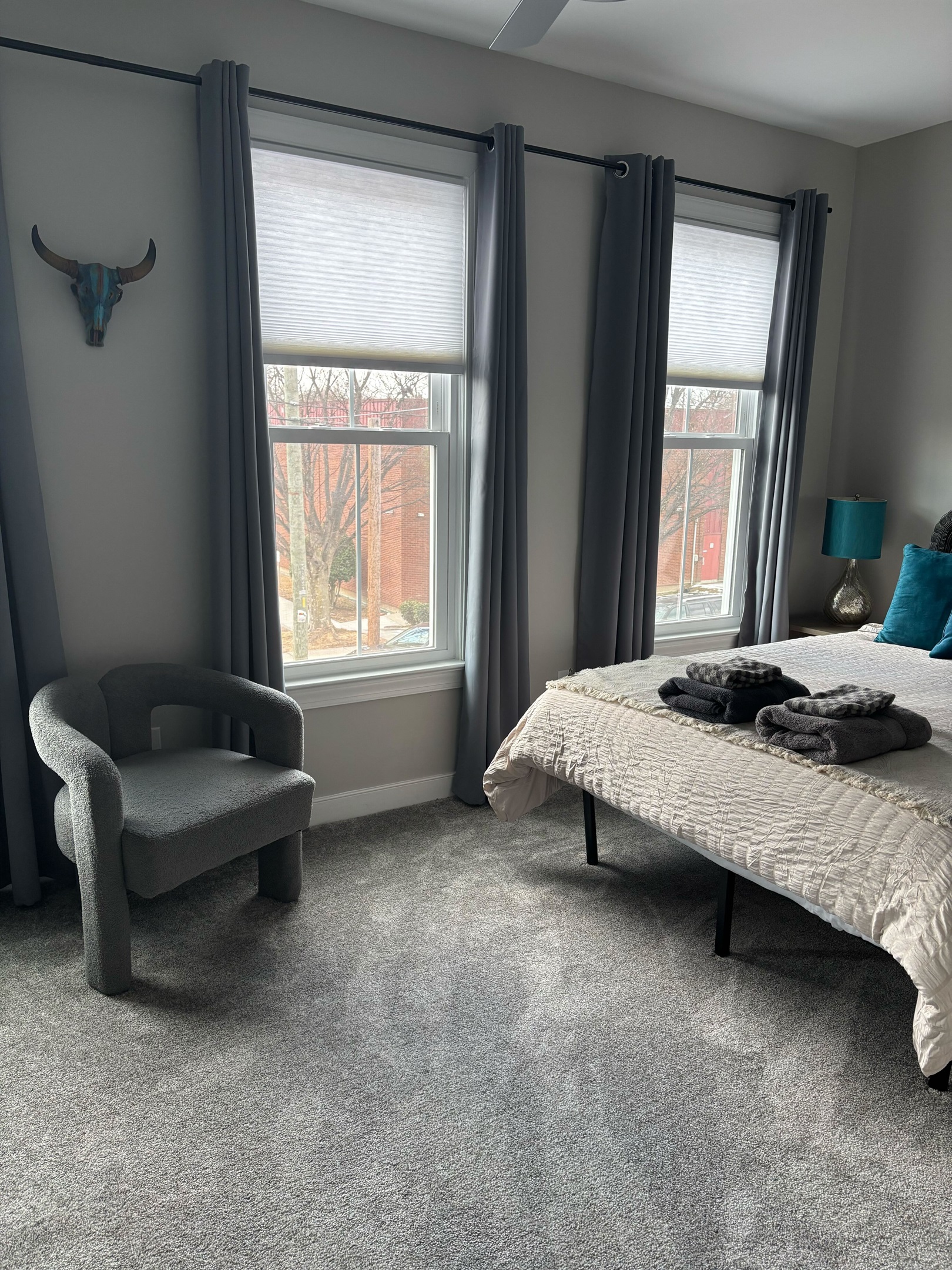 Queen Bedroom 2: Bright room with plush bedding, stylish decor, and sunny views for relaxation. Added Room Darkening Shades