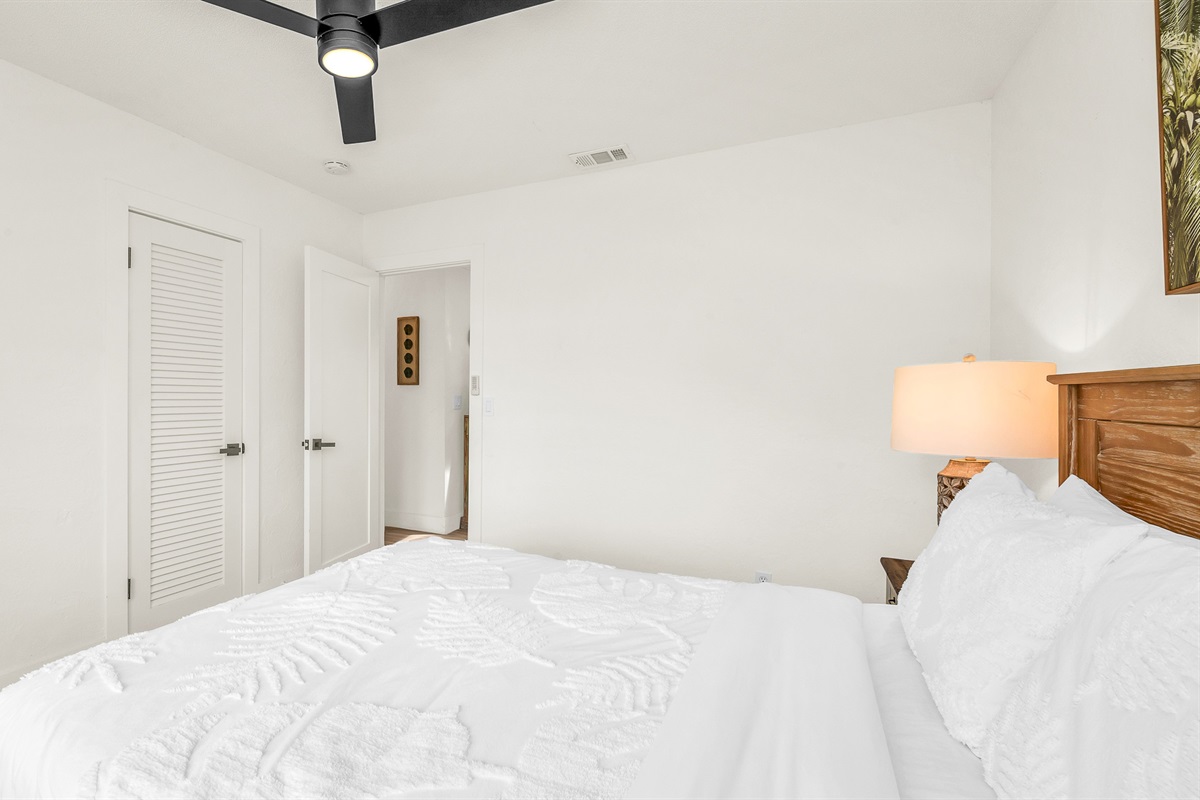Bedroom 2 offers a relaxing coastal vibe with crisp linens, warm natural light and elegant decor- perfect for guests seeking comfort and tranquility after a day in paradise