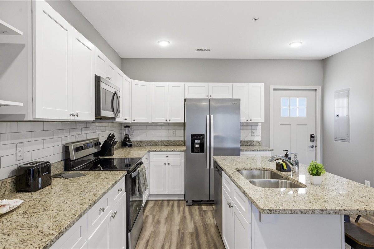 Unit 2’s kitchen is built for use, not just looks—plenty of room to prep, cook, and keep things flowing while everyone stays part of what’s going on.