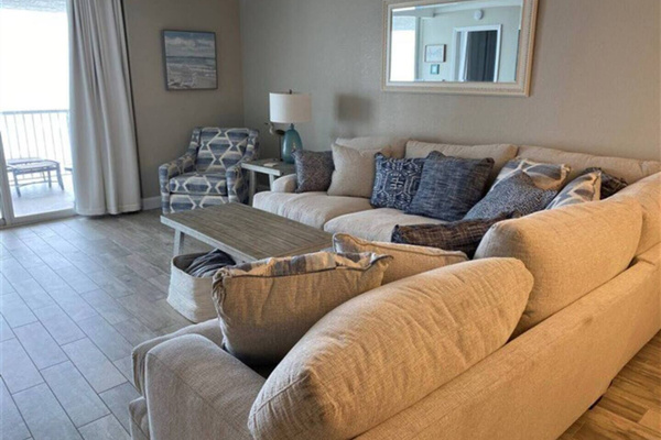 Living room slider opens to balcony and ocean view