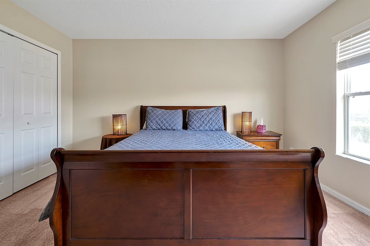Maximize your space in this light-filled upstairs bedroom with ample built-in storage