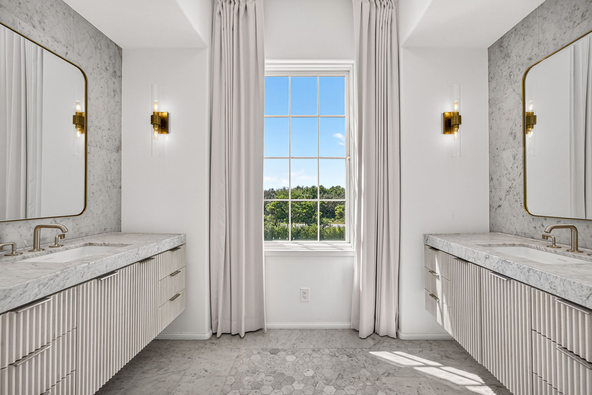 Tons of natural light and no neighbors to the rear, make this a beautiful space to get ready for the day.