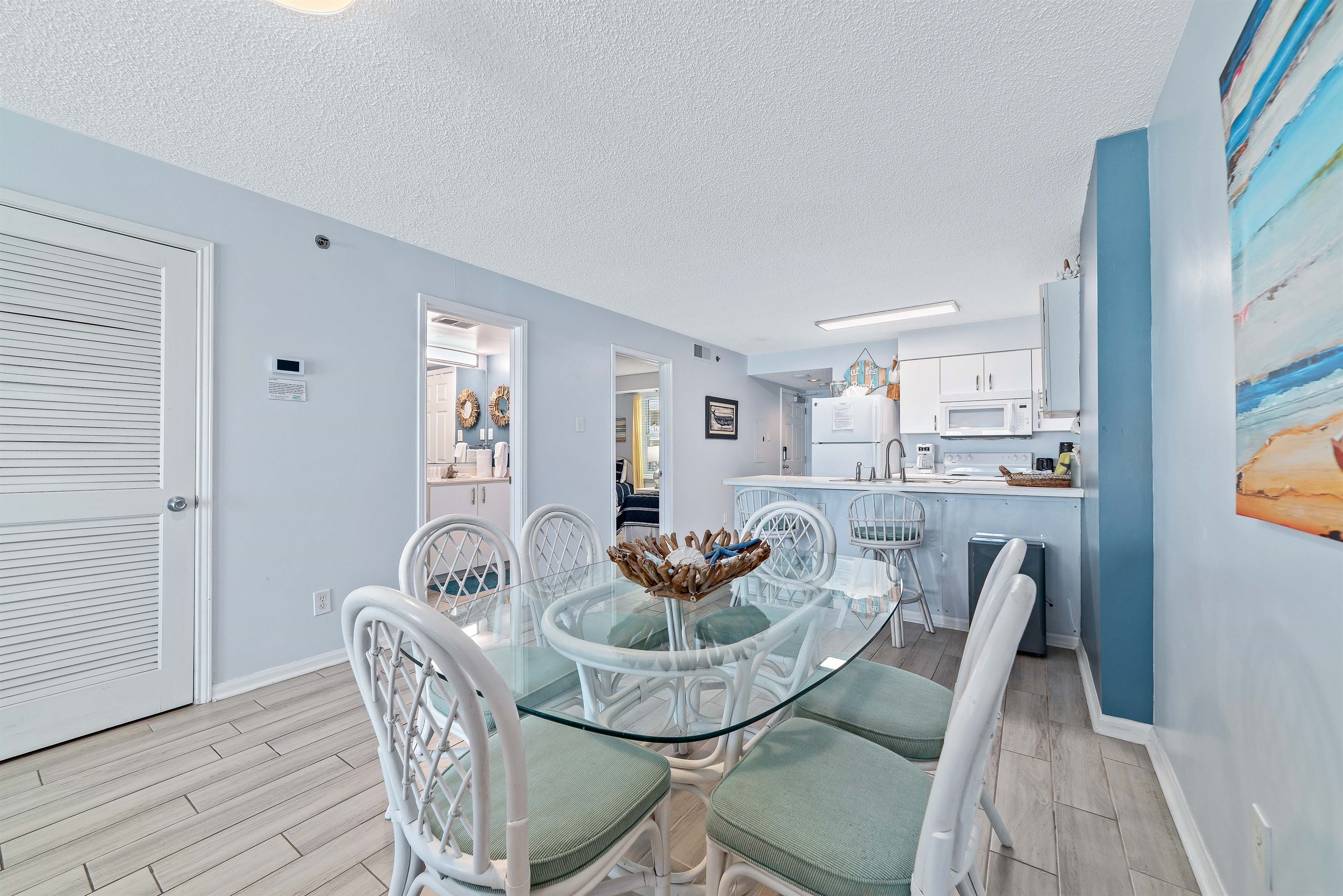 The natural textures and soft light create a serene atmosphere perfect for enjoying meals with a view.