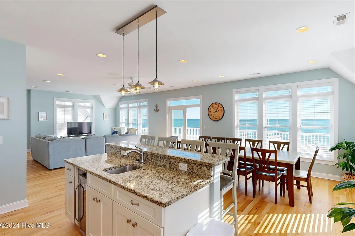 Expansive kitchen island offering additional seating for four