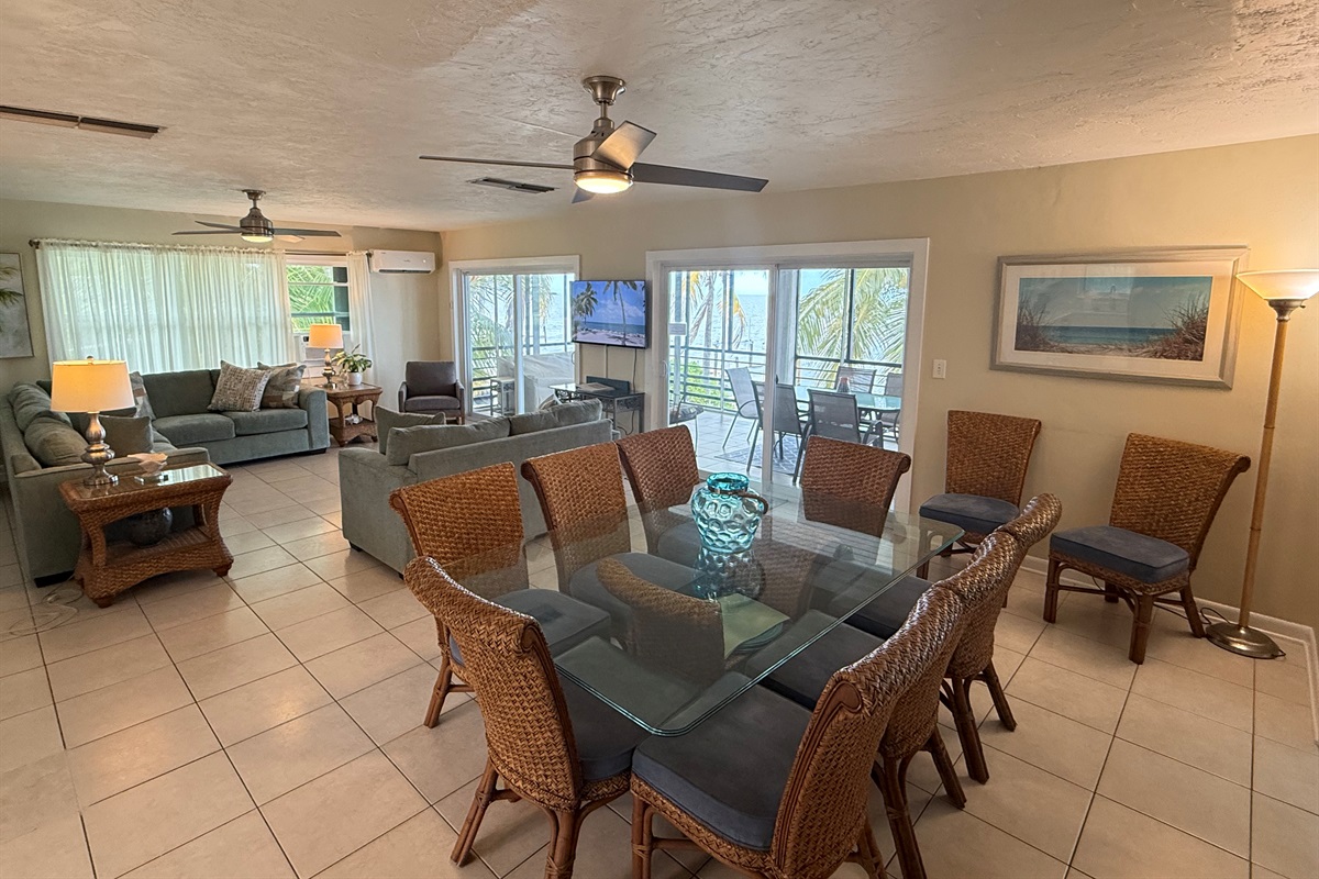 Spacious open-concept living and dining area with stunning Gulf views