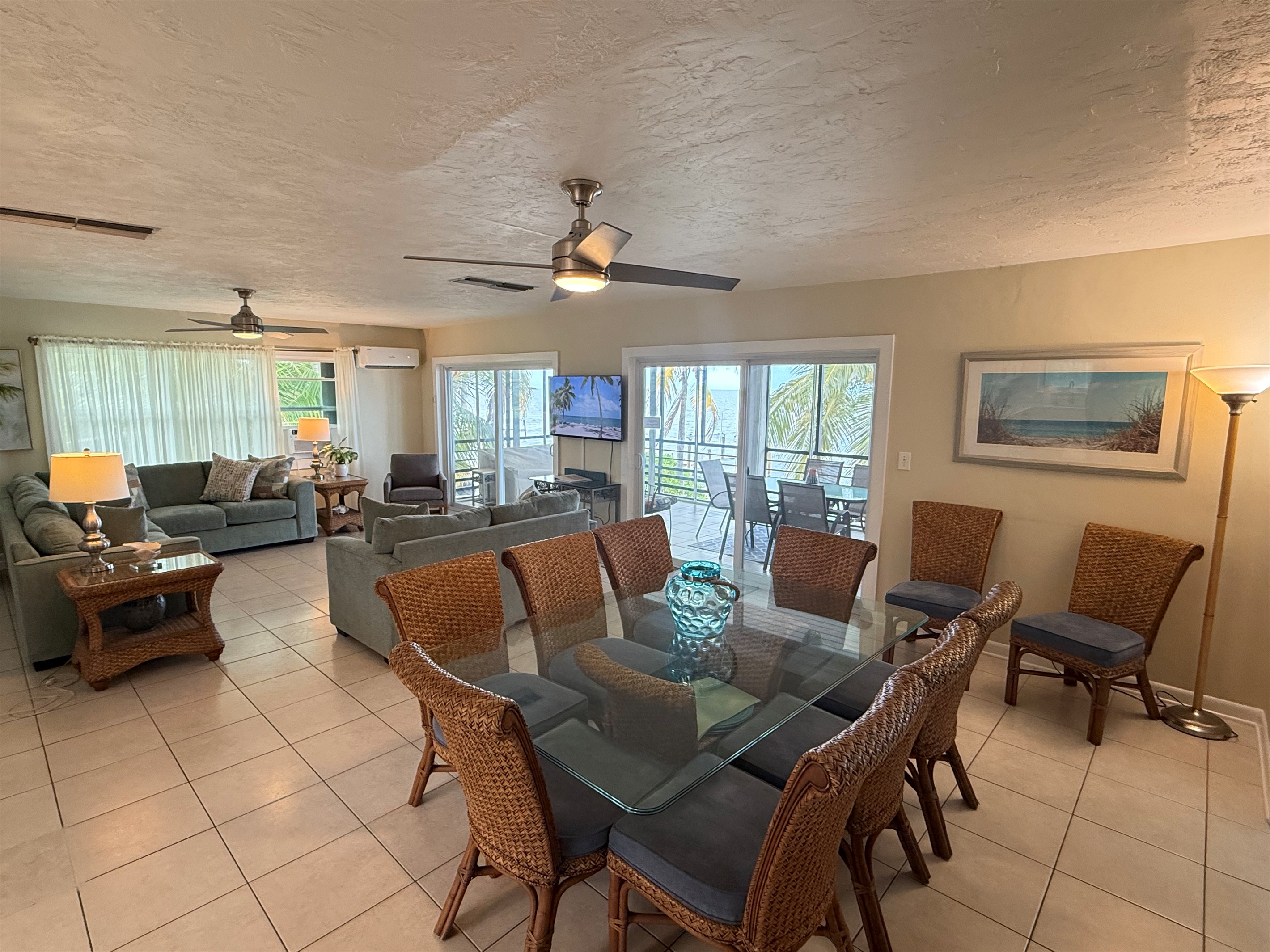 Spacious open-concept living and dining area with stunning Gulf views