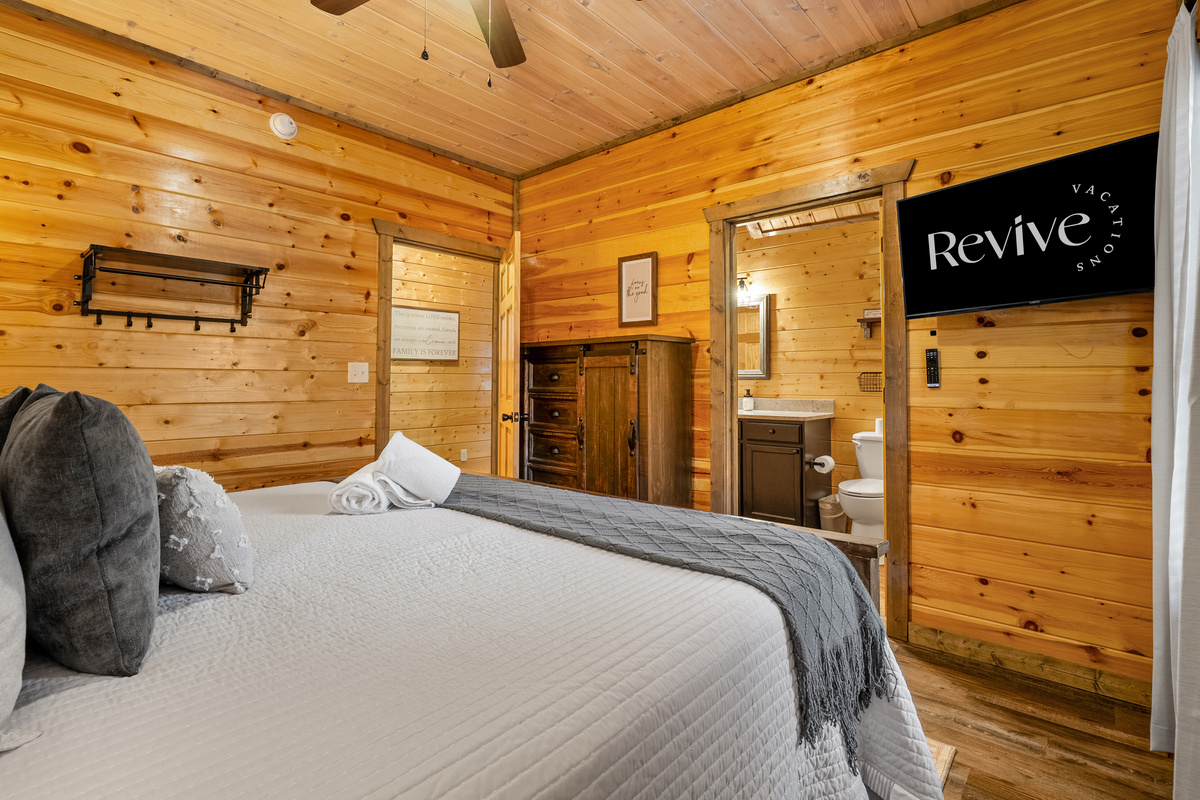 Our spacious king bedroom on the main floor with en suite and TV.