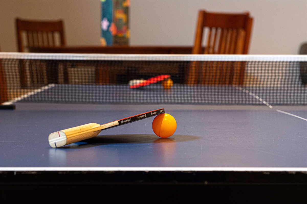 Game Room: Unleash your competitive spirit with our ping pong table and fun-filled atmosphere!