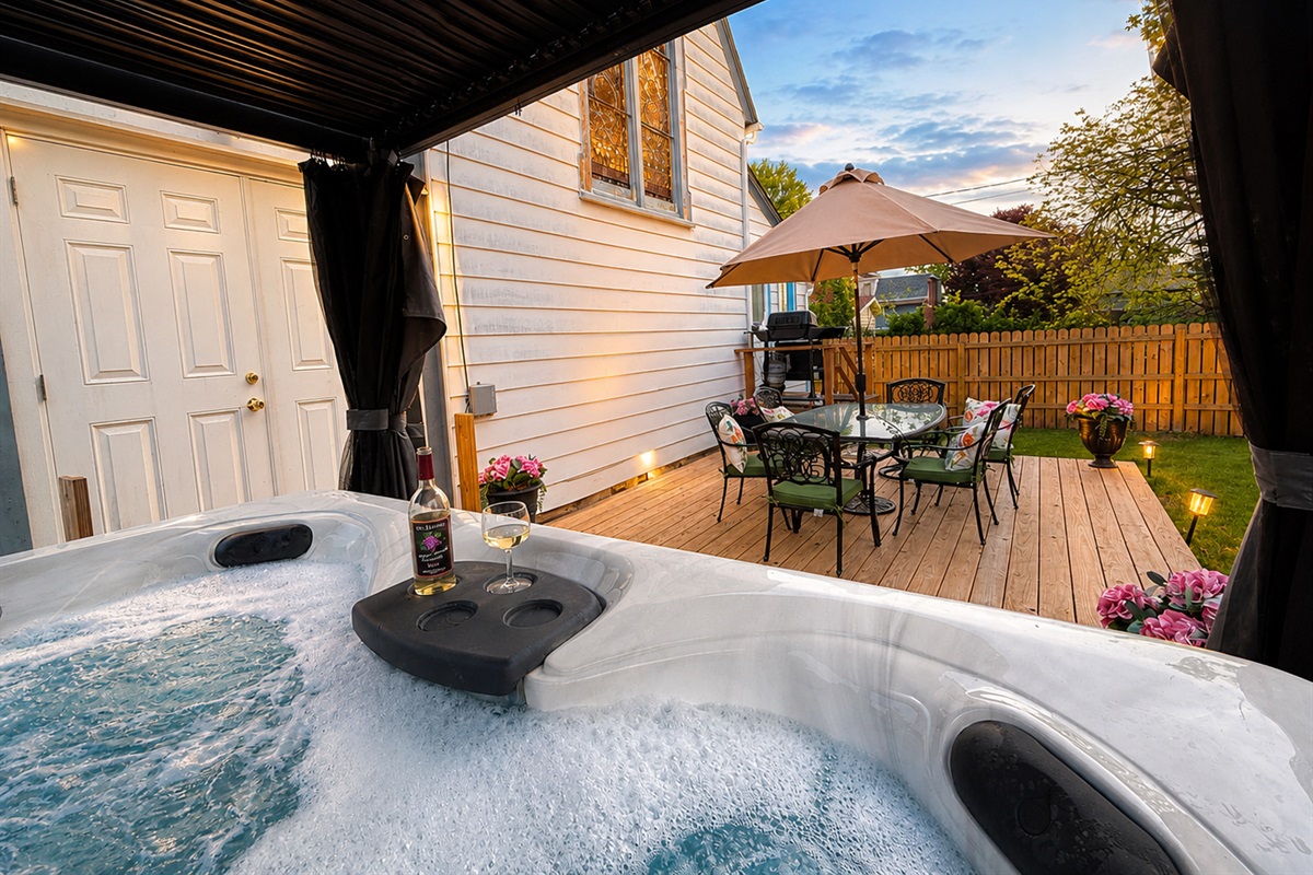 This lovely hot tub in the backyard will be the ultimate relaxation spot.