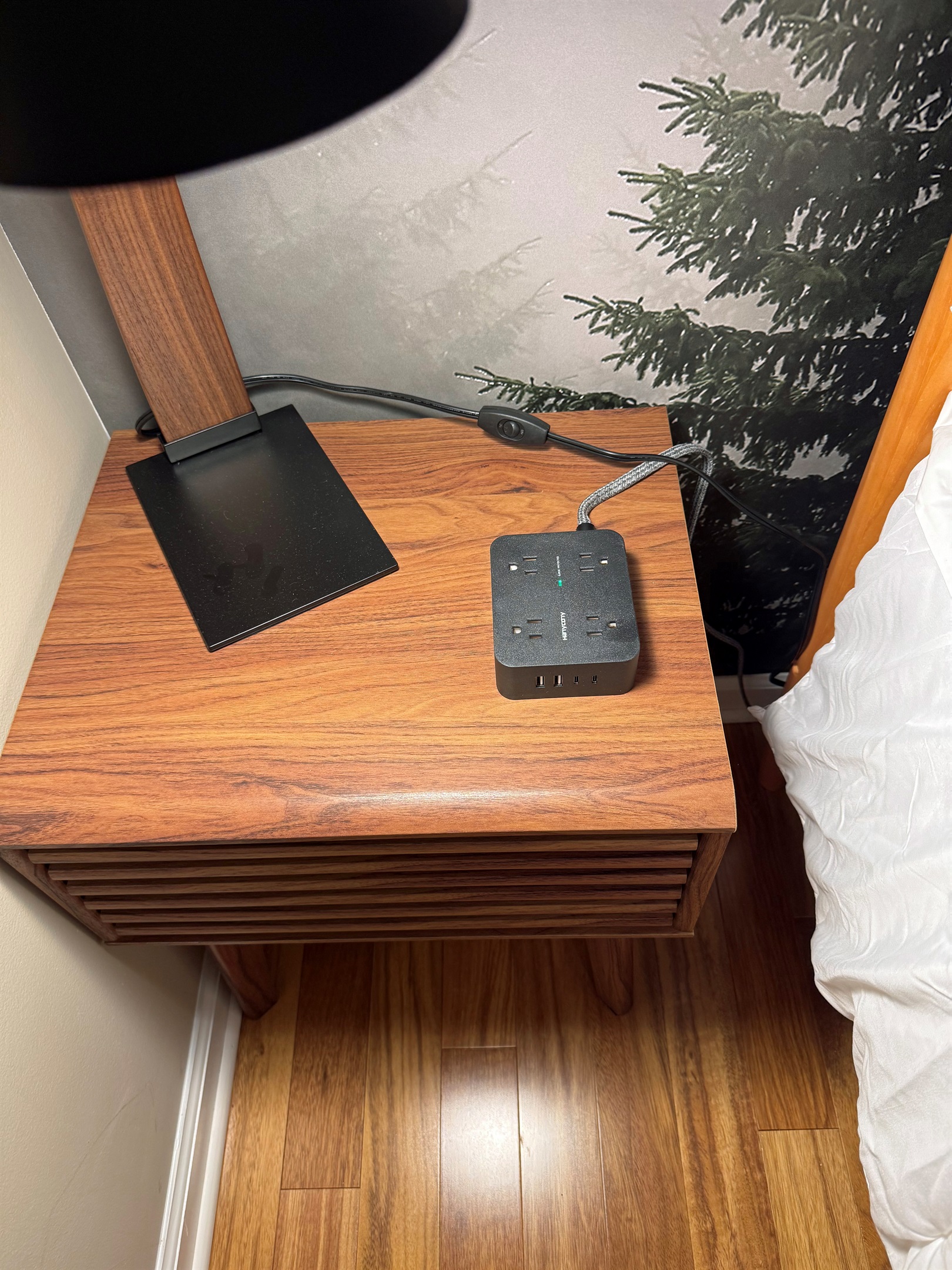 Each side table has a charger and/or device charger included.  Hunting around for available wall outlets is not relaxing so stay at Acorn&Antler and skip that step.