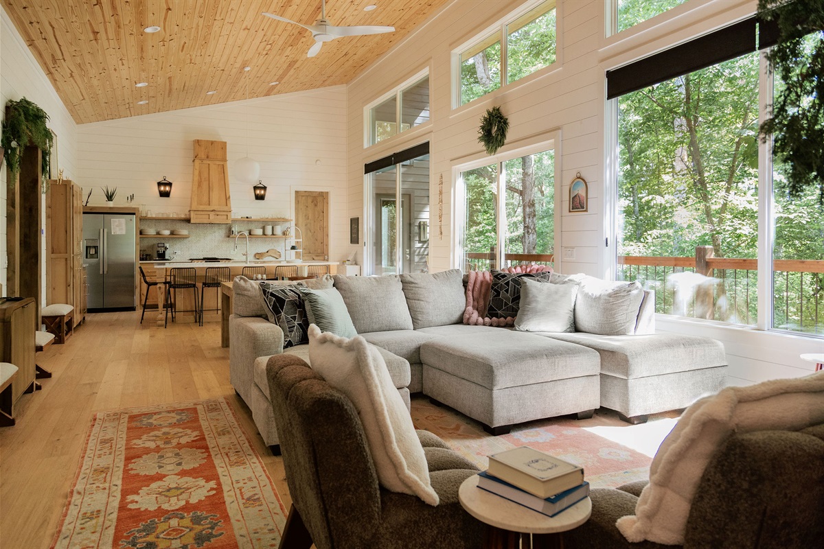 Large windows make this living space feel like outdoor luxury