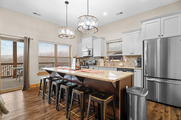 Lower level FULL kitchen. Refrigerator, dishwasher, oven/ceramic glass cooktop, microwave, drip coffee maker, Keurig, and Nespresso. Stocked with small appliances, cookware, bakeware, utensils, dishes, glassware, mugs, and more!